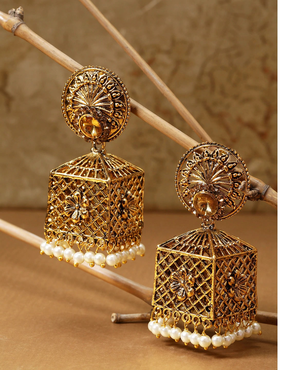 Senco Gold & Diamonds - Delicate rezi work, coin art, and colored stones  come together to create the 'Antiquated Rezi Gold Jhumka Earrings'. A  design inspired by tradition, that will surely add