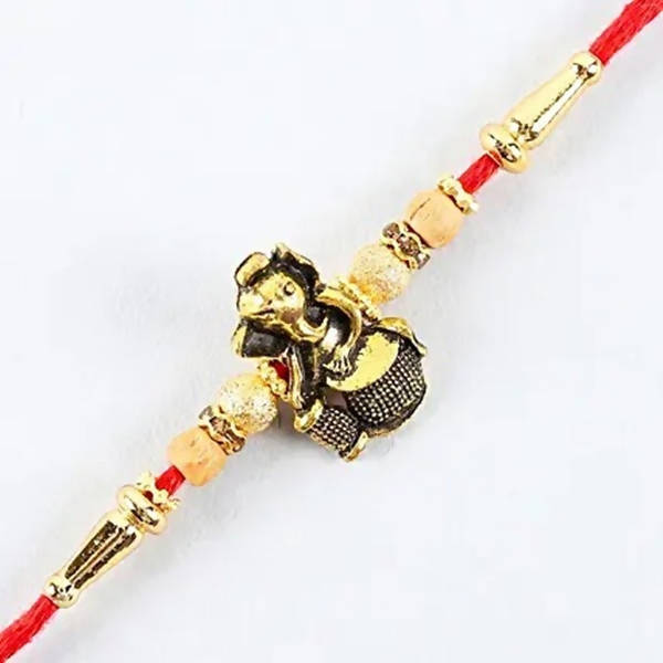 Devotional Lord Ganesha Rakhi & 2 Dairy Milk Silk - Distacart