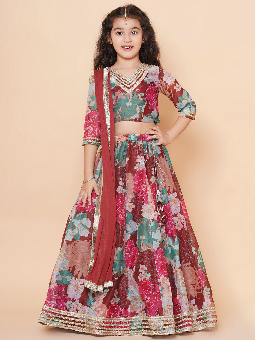 MAROON AND IVORY ABSTRACT PRINTED LEHENGA SET AND A MATCHING ZARI WORK  BLOUSE PAIRED WITH A MATCHING DUPATTA AND SILVER EMBELLISHMENTS. - Seasons  India