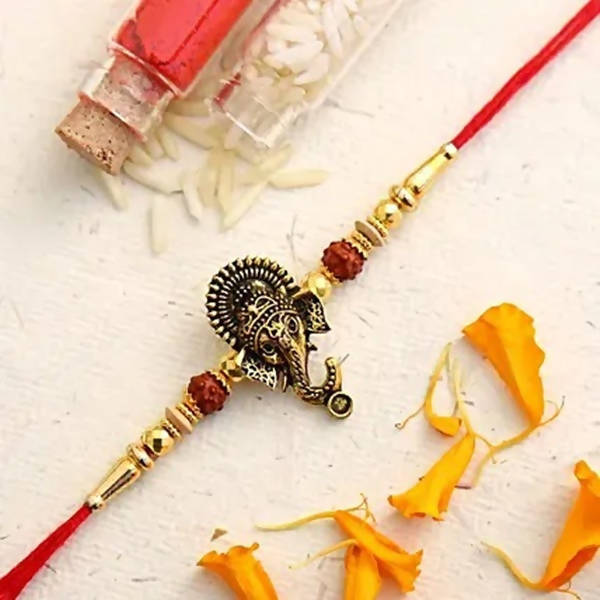 Lord Ganesha Rudraksha Rakhi & 2 Dairy Milk Silk - Distacart